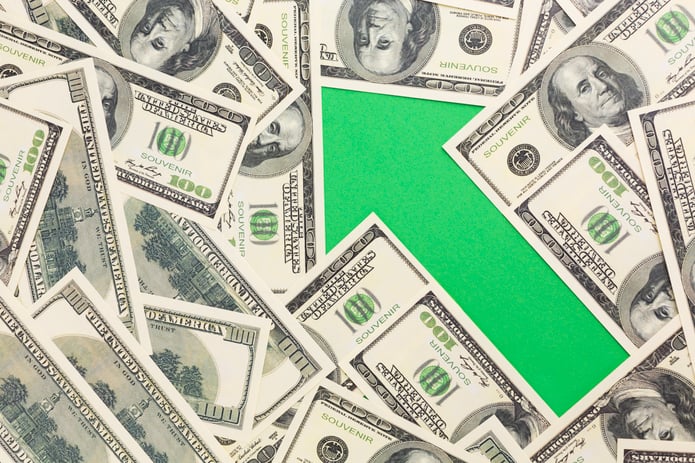 dollar bills with green arrows