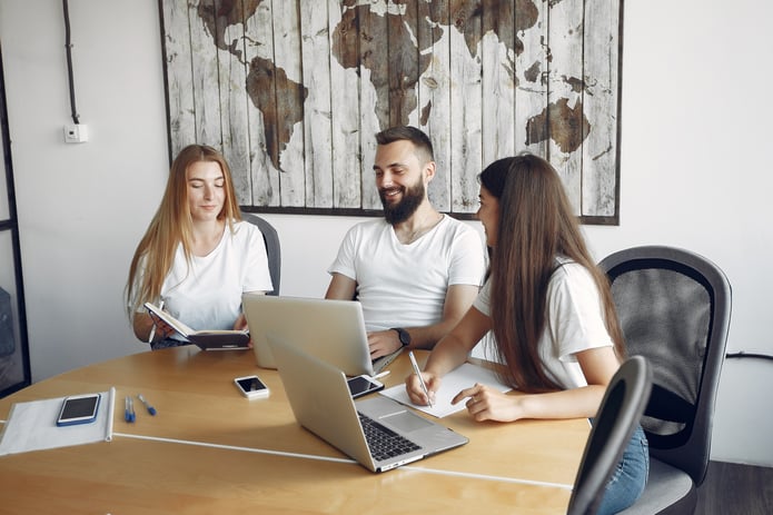 young-team-working-together-use-laptop